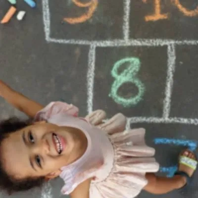 Girl playing hopscotch